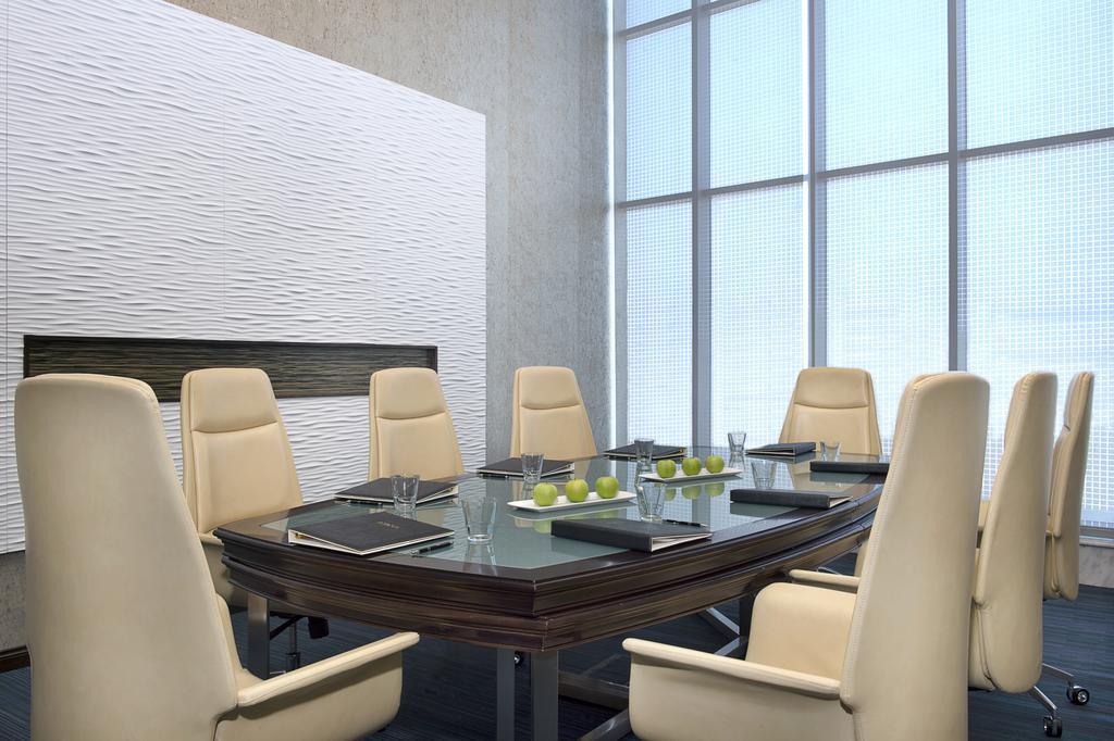 Atana Hotel Dubai Esterno foto A meeting room in a modern office building.